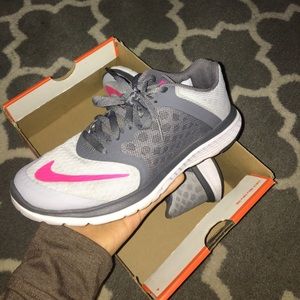 Grey and pink Nike shoes