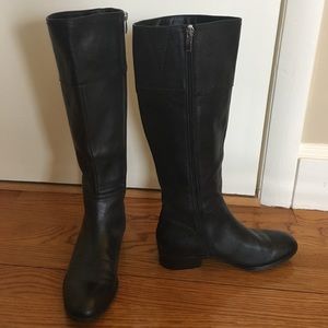 Flat black leather zip-up boots