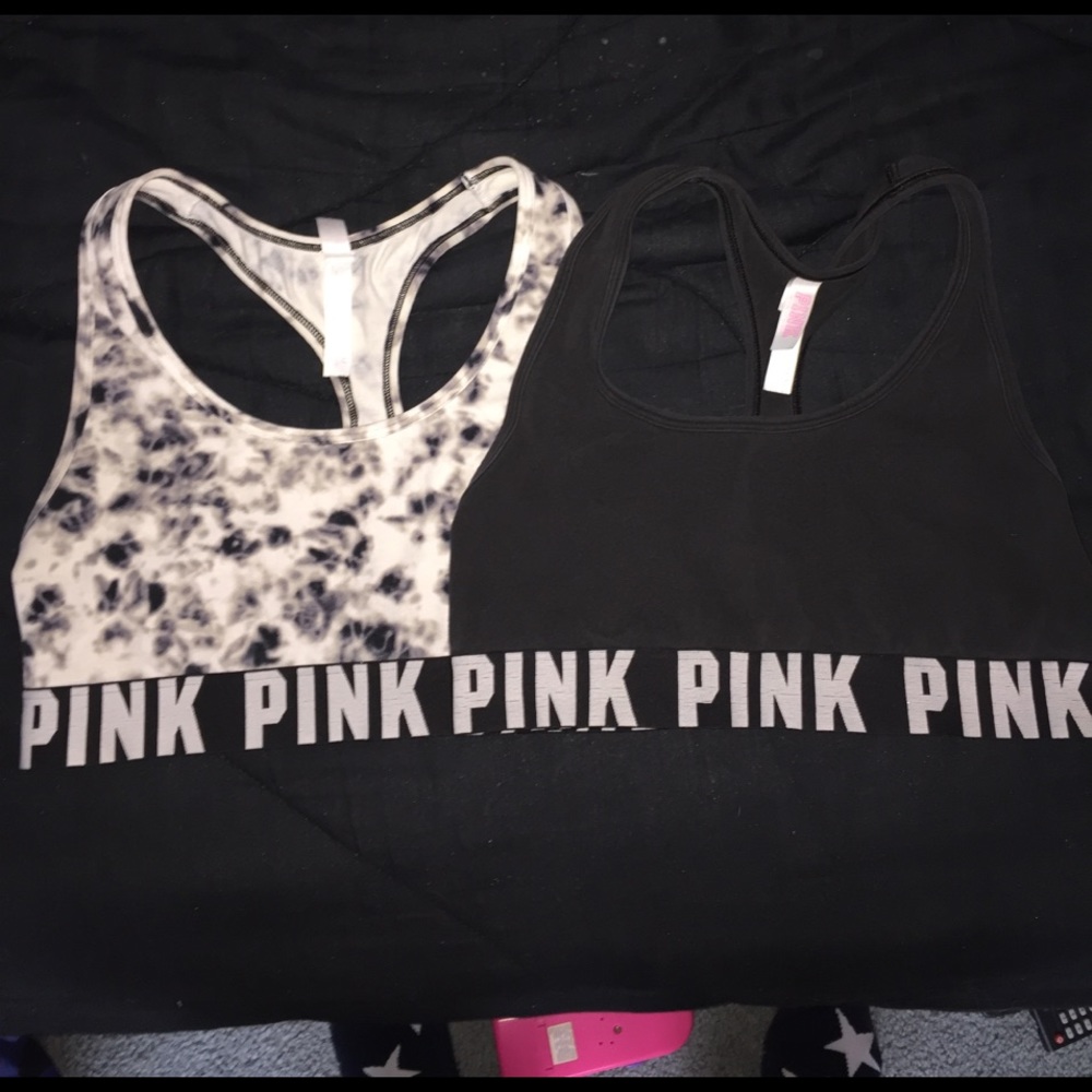 Two PINK sports bras