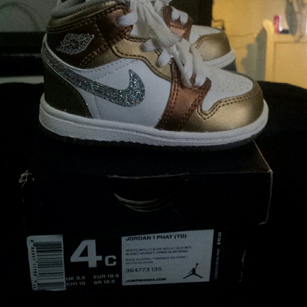 Gold and white Jordans