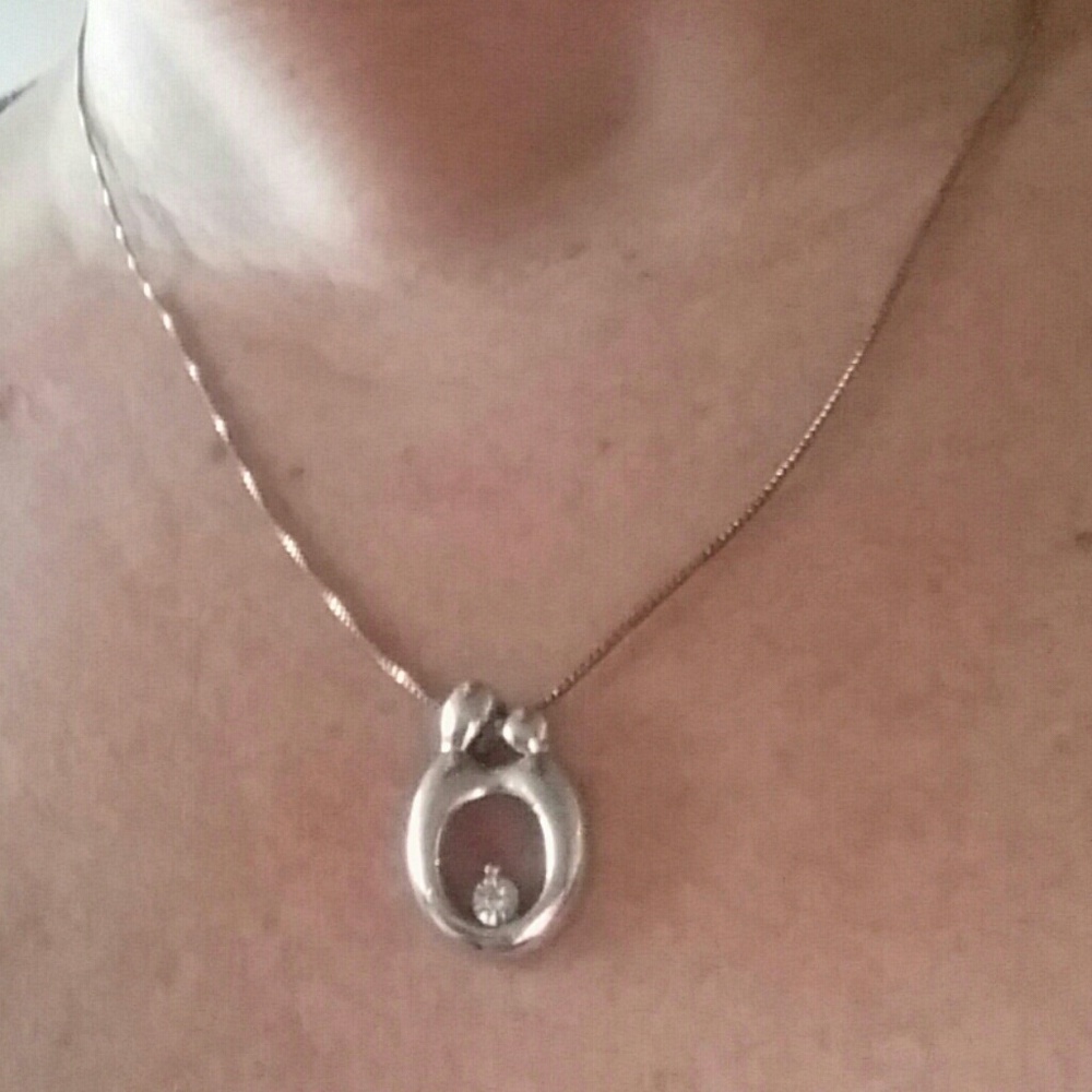 Diamond Necklace representing Mother and child.
