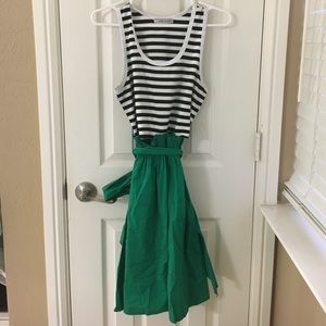 Black, white, and green flared sleeveless dress