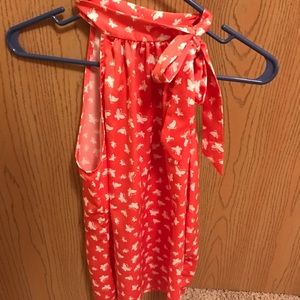 Bright coral sleeveless top w/white butterflies.
