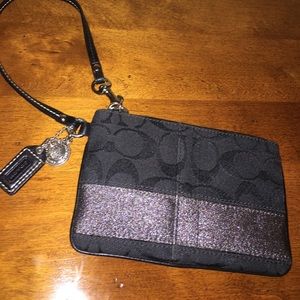 COACH WRISTLET BLACK WITH SPARKLY STRIPE.