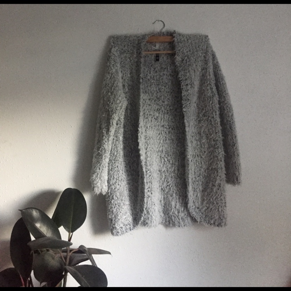 Fuzzy light grey sweater.