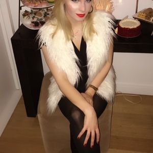 White fur vest