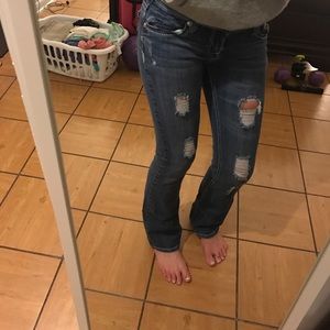Distressed boot cut jeans