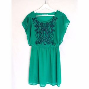 Francesca's emerald green embroidered dress