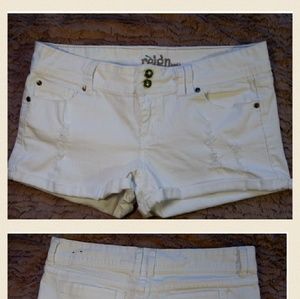 Cute white distressed women's shorts.