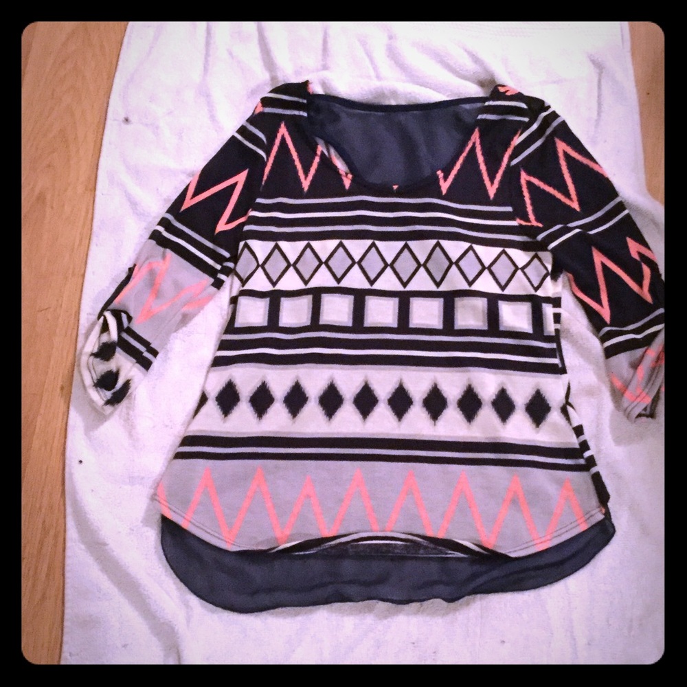 Multicolored, multi patterned blouse.