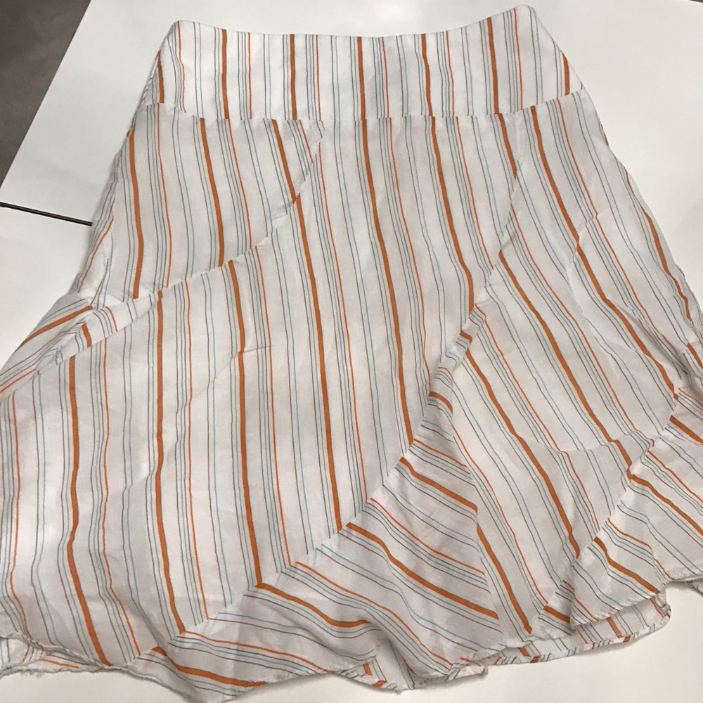 White skirt with orange and teal stripes