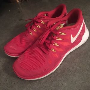 Pink and orange Nike shoes