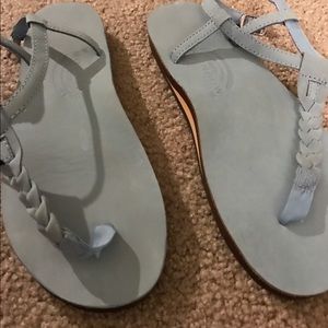 Light blue Rainbow T strap sandals.