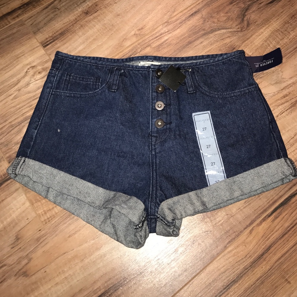 Cuffed dark denim shorts.