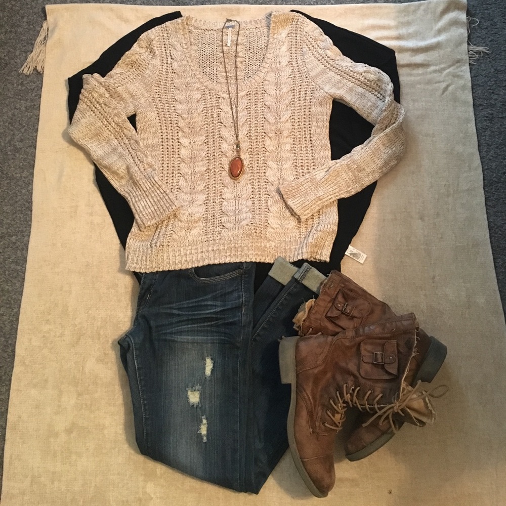 A beautiful cable knit free people sweater