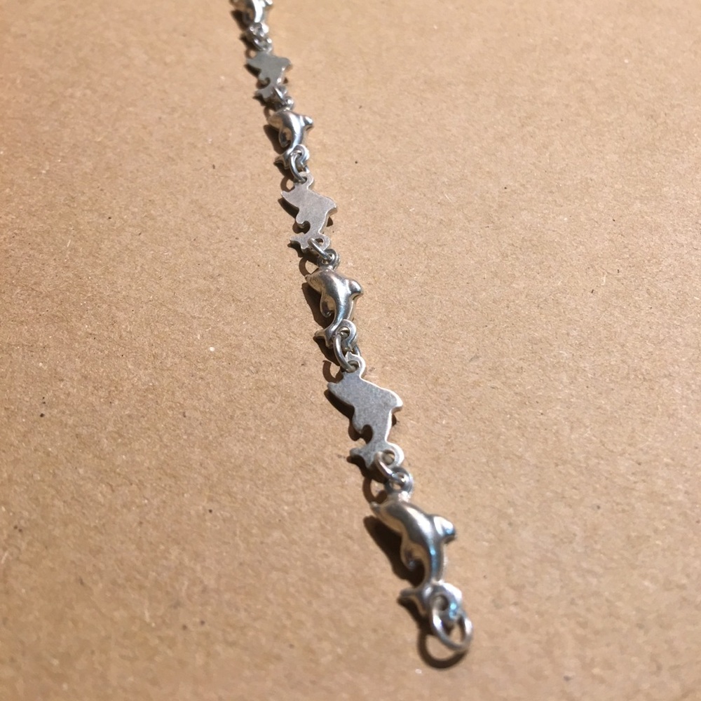 Sterling silver dolphin bracelet.
