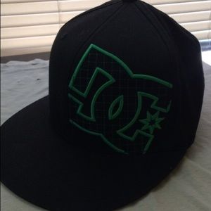 Green and black DC fitted hat. 7 1/8"