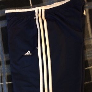 Blue and white Adidas track pants