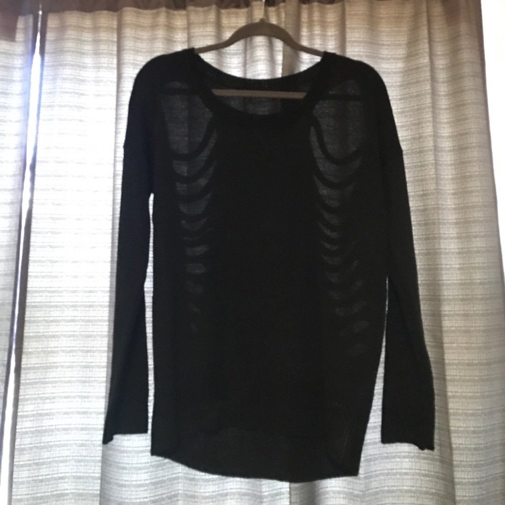 Black sweater with rips in back