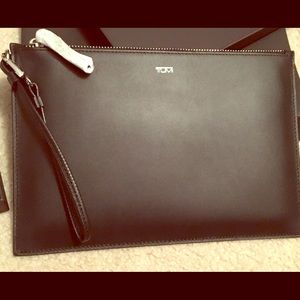 Tumi wristlet. Never used. Black.