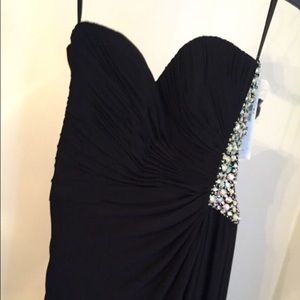 Black, strapless, beaded dress with side slit