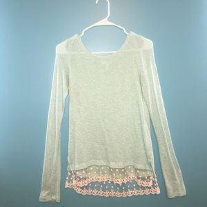 Teal colored long sleeve shirt