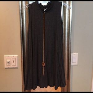 Sleeveless dress with high neck