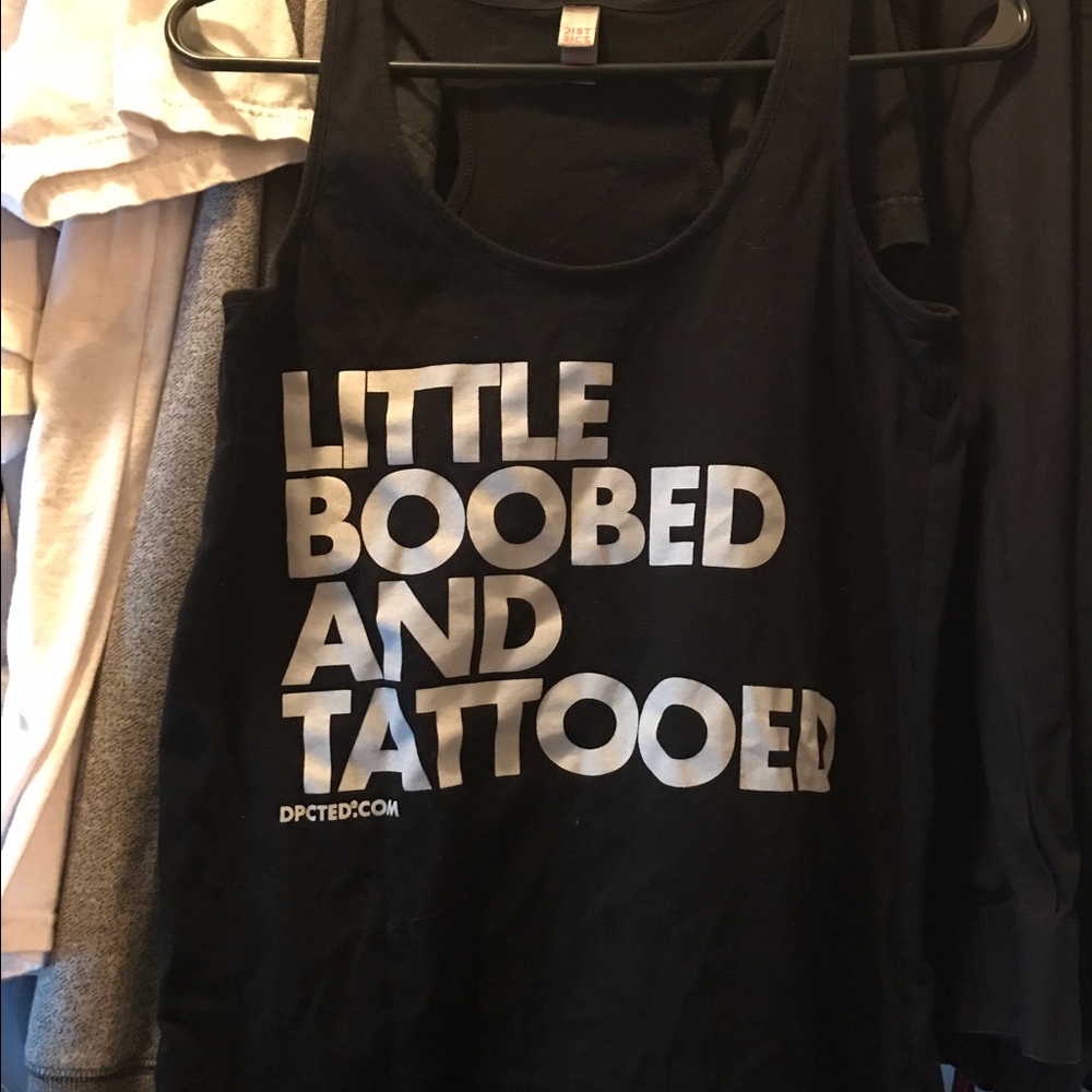 "Little boobed and tattooed"