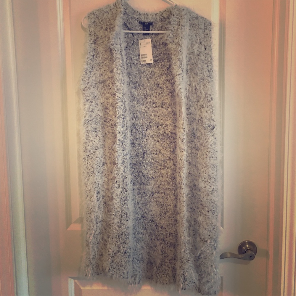 Long sleeveless sweater