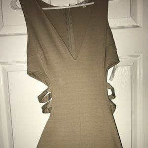 Grey dress with cut out sides .