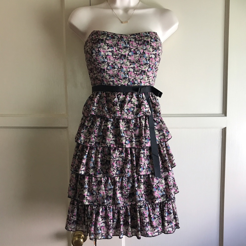 Strapless floral dress with bottom ruffles.