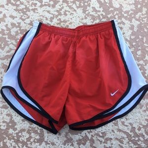 Red Nike shorts