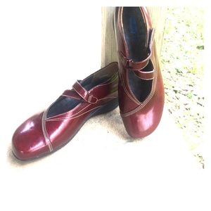 Slightly worn, candy apple red Wolky shoes