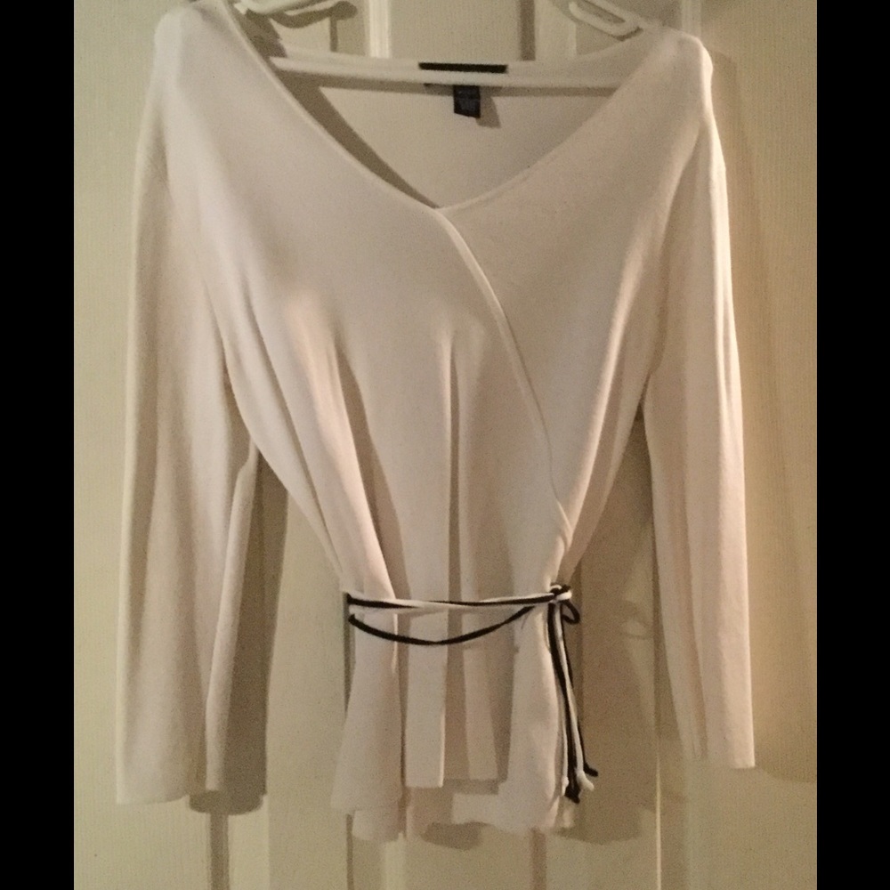 White wrap top with black and white belt