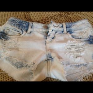 Blue jean shorts. Distressed look