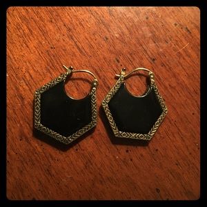 Black earrings with a gold outer lining