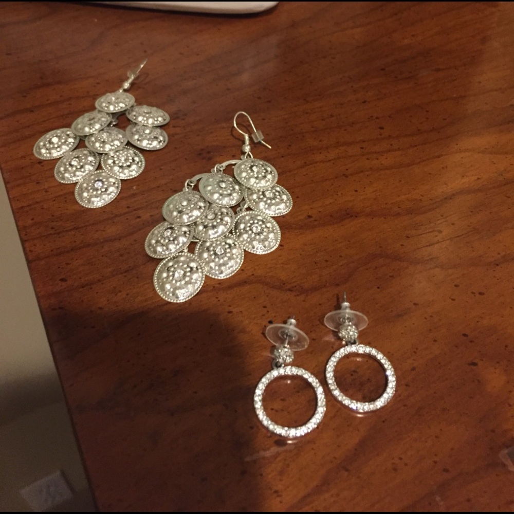 Two pair silver tone costume earrings.