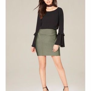 Green mini skirt by Bebe