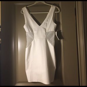 Cute fun white dress. NWT!! Mesh cut out sides!