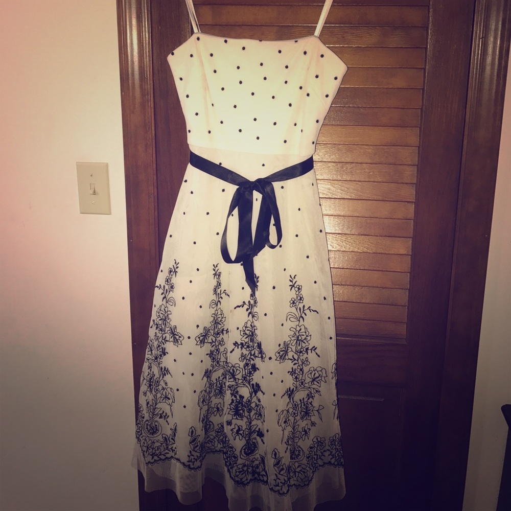 Beautiful white dress with black floral and ribbon