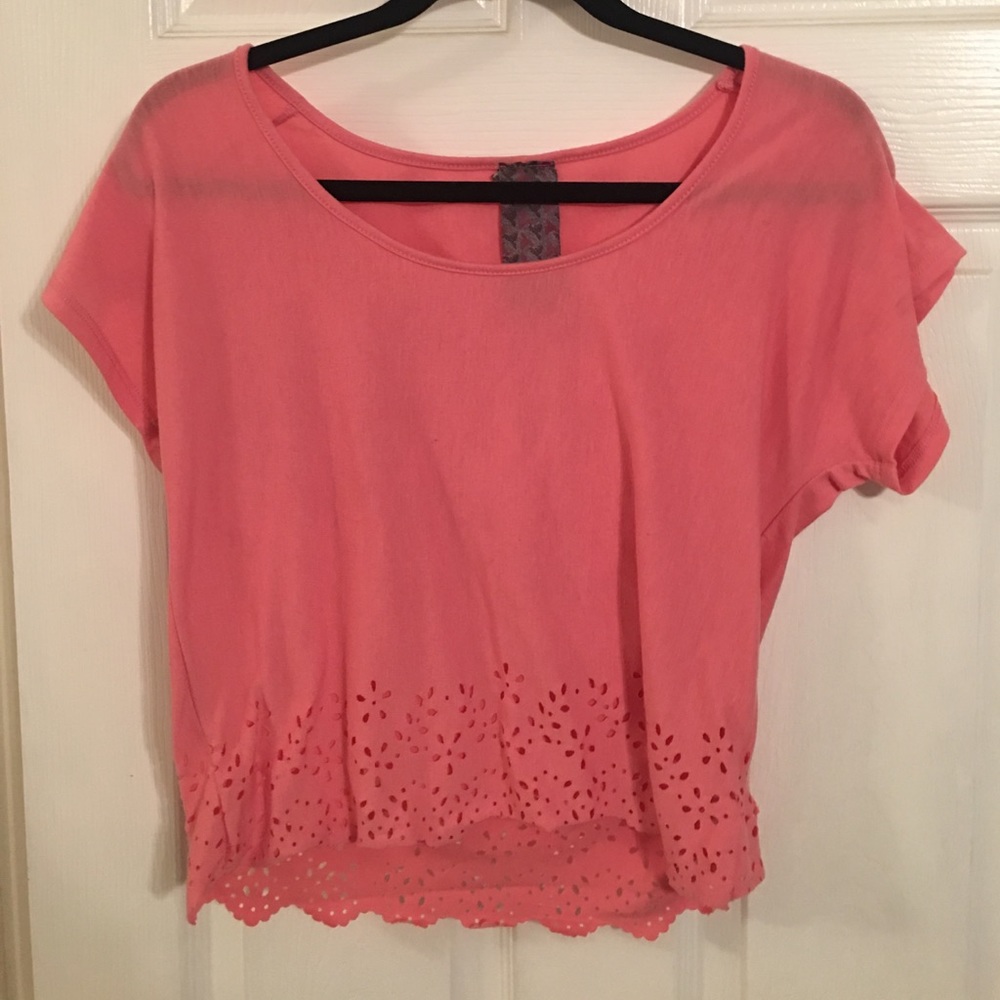 Pink top with flower cutouts trimming