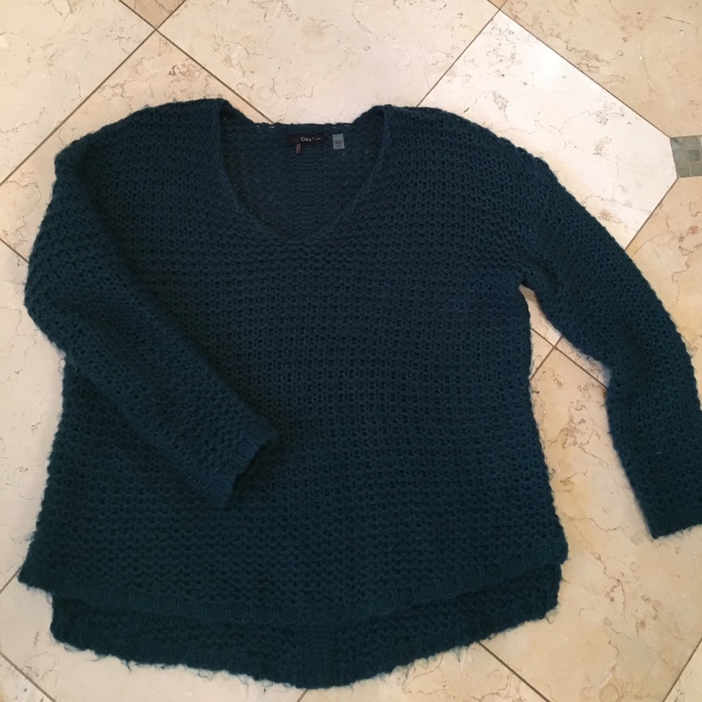 Deep blue-green sweater.