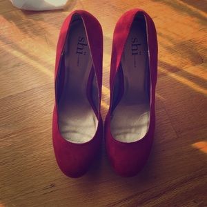 Red heel pumps