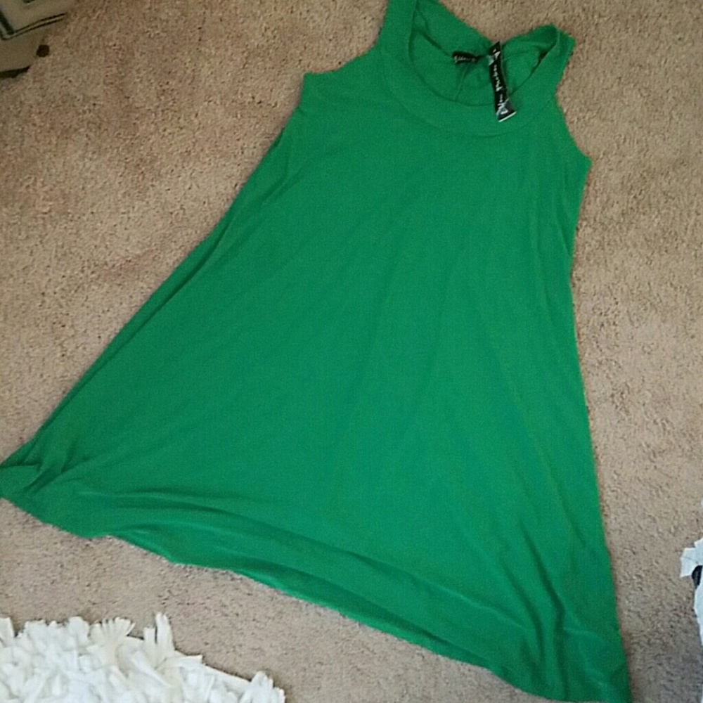 Brand new sleeveless, flared dress.