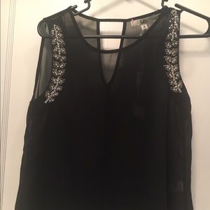 Sheer sleeveless black top