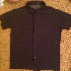 Button up grey collared shirt.