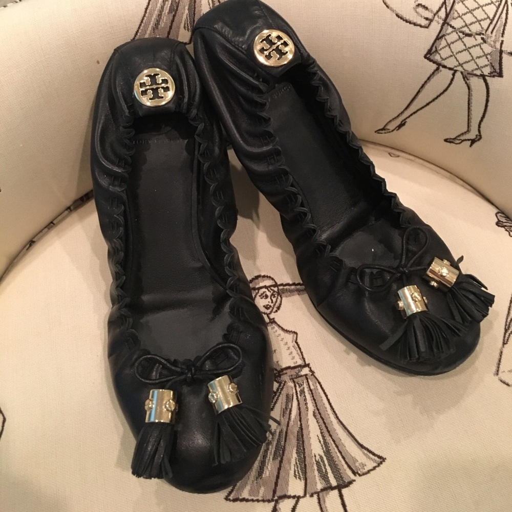 Tory Burch black flats with tassel.