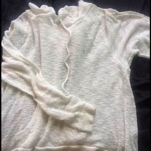 A white sweater. It it good for the summer.