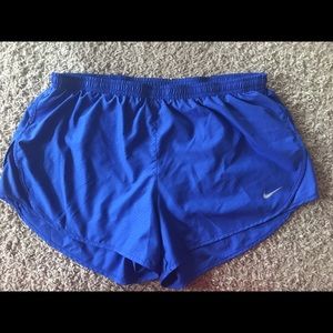 Blue Nike running shorts