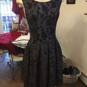 A black dress with rose design. 💗